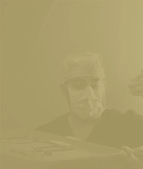 Doctor Shuja working with medical tools in warm sepia-toned photograph